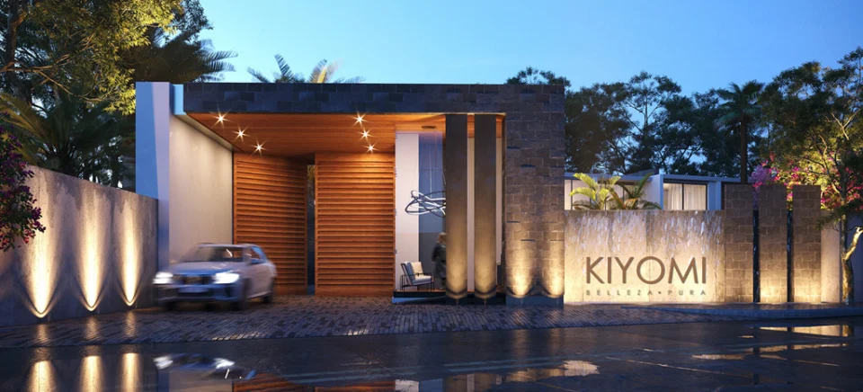 Render de Kiyomi al anochecer: fachada de piedra y madera, letrero iluminado y carro en movimiento.